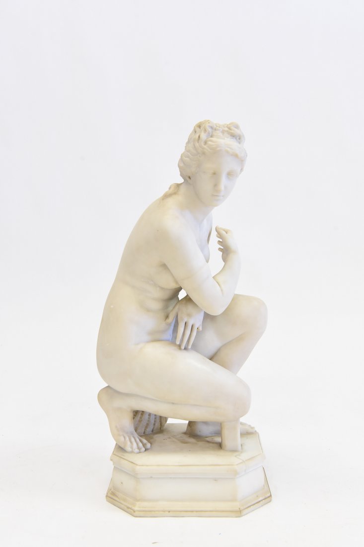 19TH CENTURY FEMALE MARBLE SCULPTURE: The Crouching Venus from the Grand Tour, Carrara marble figure. Dimensions: H 24" x W 13" x D 10" Condition Surface dirt. Hairline crack on the top surface and left hand missing finger broken off.