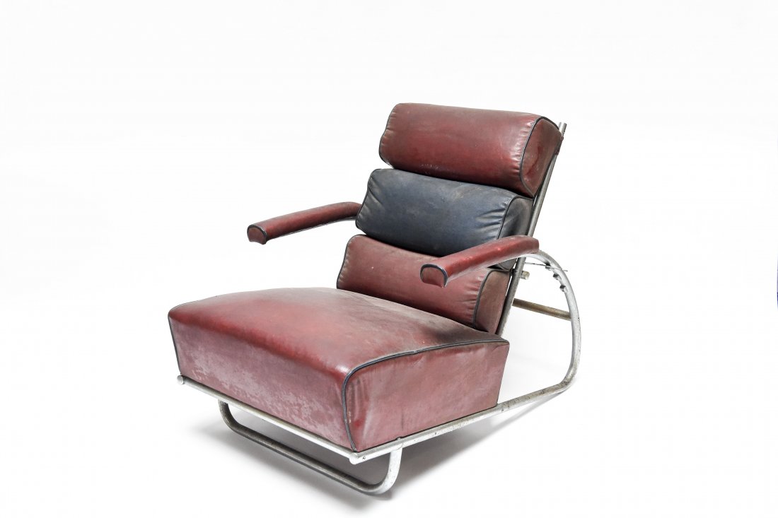 GILBERT RHODE ADJUSTABLE RECLINER LOUNGE CHAIR: C.1930s for the Troy Sunshade Co. and pictured in the 1934 catalog Dimensions: H 30" (fully upright) x W 25.75" x D 38" Condition: Wear to oil cloth, cracking and light rust and oxidation to metal