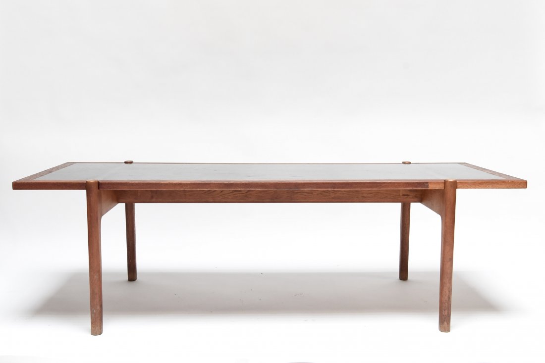 HANS WAGNER REVERSIBLE COFFEE TABLE: JOHANNES HANSEN Dimensions: H 19" x W 63" x D 24.5" Condition: Light marks and scratches to table top