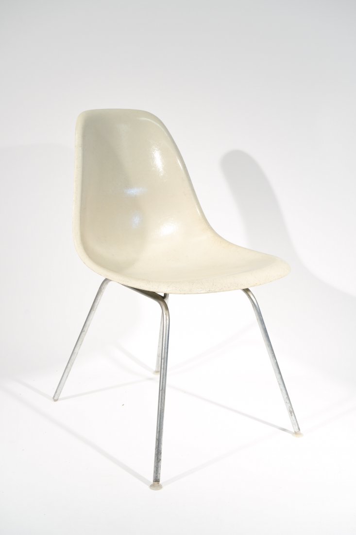 CHARLES EAMES; HERMAN MILLER FIBERGLASS CHAIR: Dimensions: H 31" x w 18.5" x D 21.5"; Condition: Some light wear to the base finish.