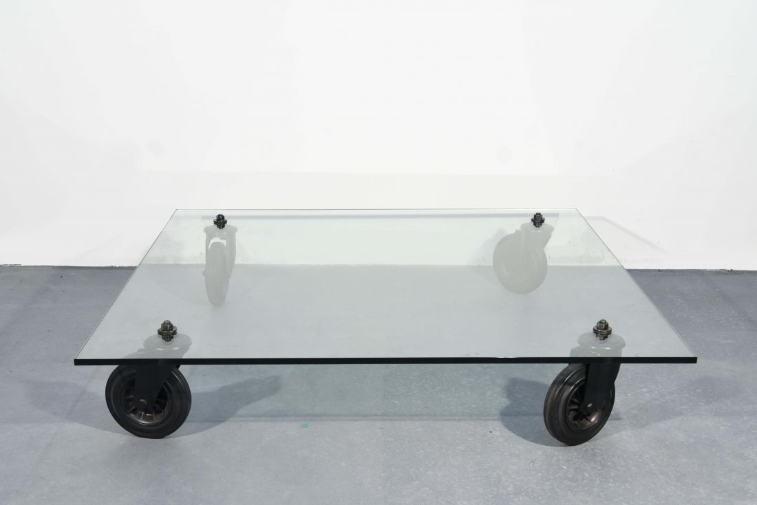 GAE AULENTI; FONTANA ARTE TAVOLO CON RUOTE TABLE: Dimensions: H 10.5" x W 51.25" x 51.25" Condition: two fleabite chips one on underside and one on topside.
