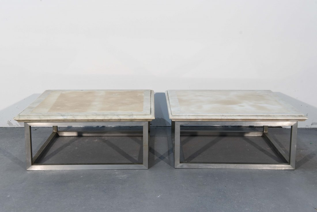 PAIR GEORGE CIANCIMINO POST MODERN SIDE TABLES: Marble and steel Dimensions: H 12" x W 27" x D 27" Condition: Chips and cracks to edges of marble, one piece missing slate filler underneath