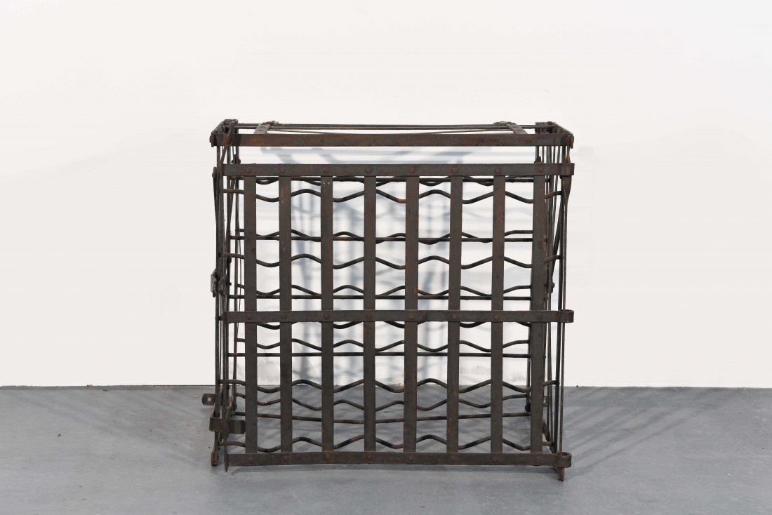 GERMAN IRON WALL-MOUNTED WINE RACK: 20TH C. Dimensions: H 23" x W 25" x D 22" Condition: Nothing to note