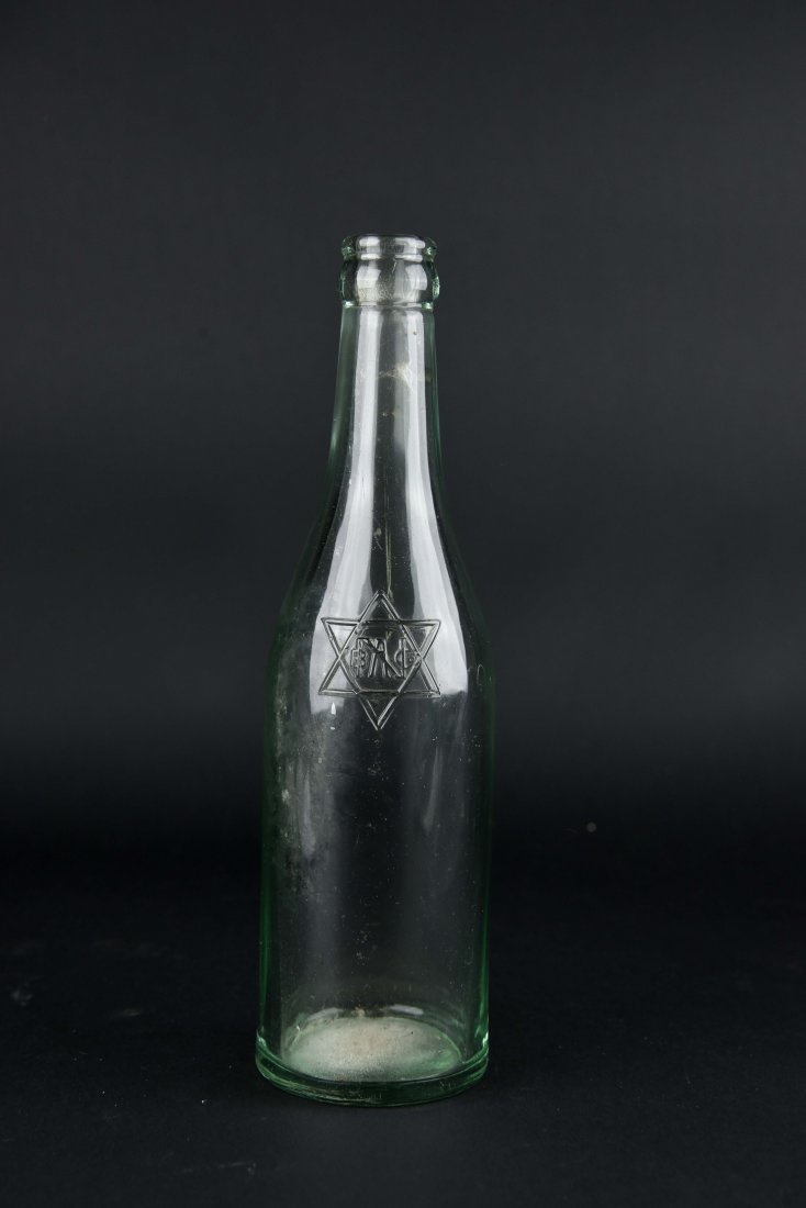 JEWISH GLASS BOTTLE: Dimensions: H 9.25" x DIA 2" Condition: scratches to bottom edge and some scratches to side