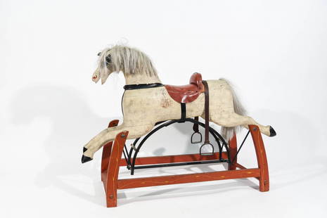 FOLK ART ROCKING HORSE: Dimensions: H 32" x W 44" x D 15" Condition: Loss of paint, worn and slightly brittle leather strap, miasing one eye