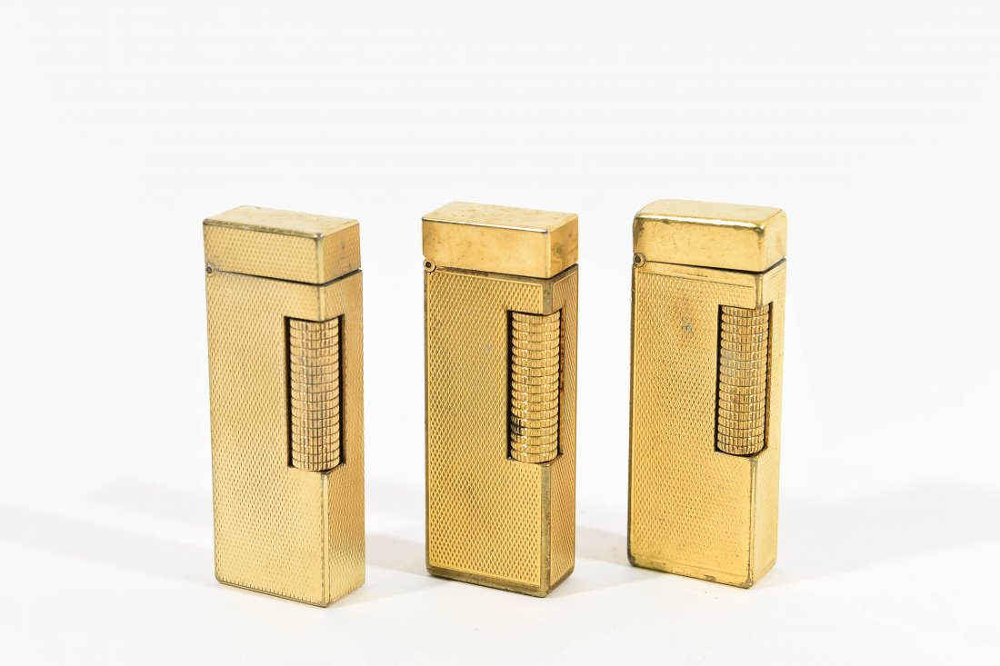 (3) DUNHILL LIGHTERS: All gold tone. Dimensions: H 2.5" x W 1" Condition: All used with light surface scratching