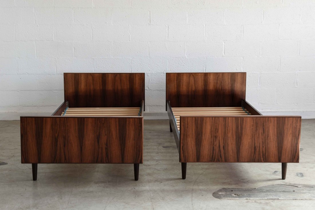 TWO SANNEMAN ROSEWOOD BEDS: Tag on bottomTwin size 1950'sDimensions: H 25.50" x W 36" x D 78"Condition: Some light scratches, and small dents to wood, minor lifting of veneer, some finish wear in a few small areas