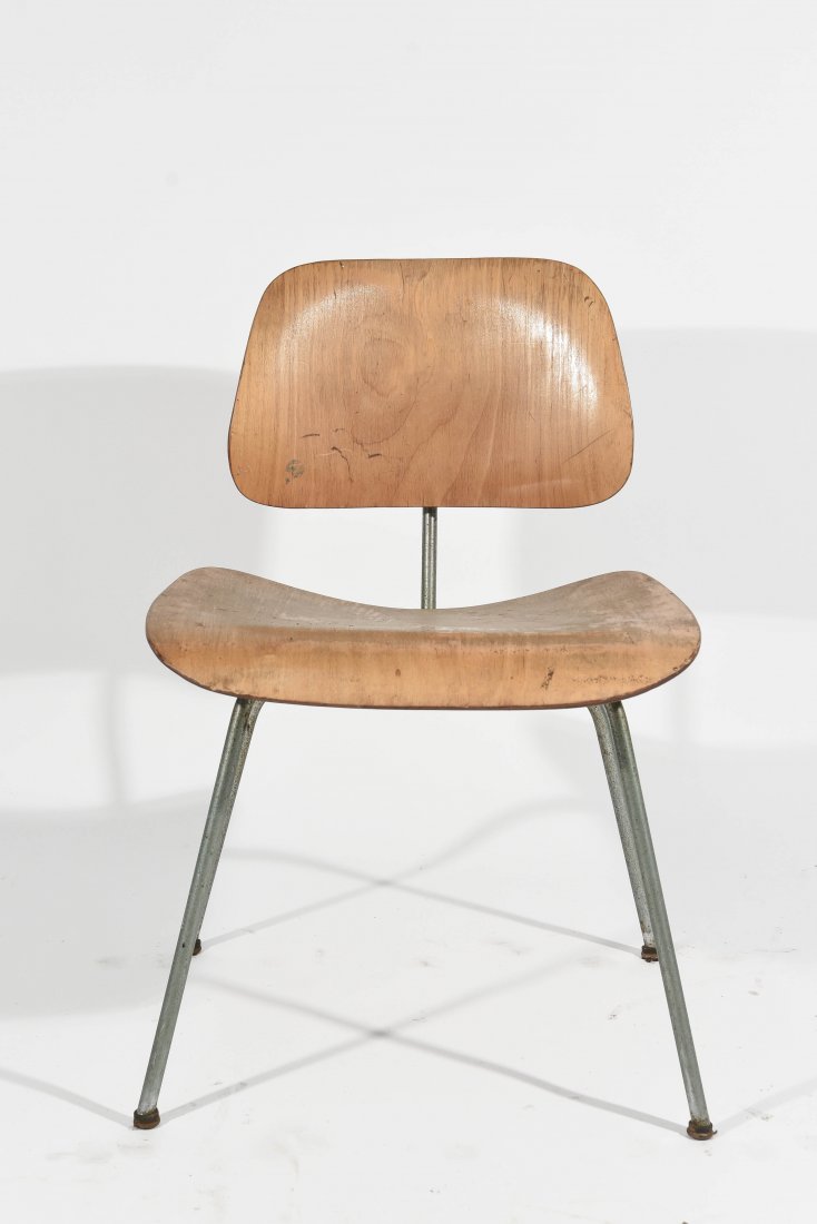 BLONDE EAMES LCM CHAIR: Dimensions: H 29" x W 19.5" x D 21" Condition: Stains and fading to wood, some light scratches and marks, few small dents and chips to edges