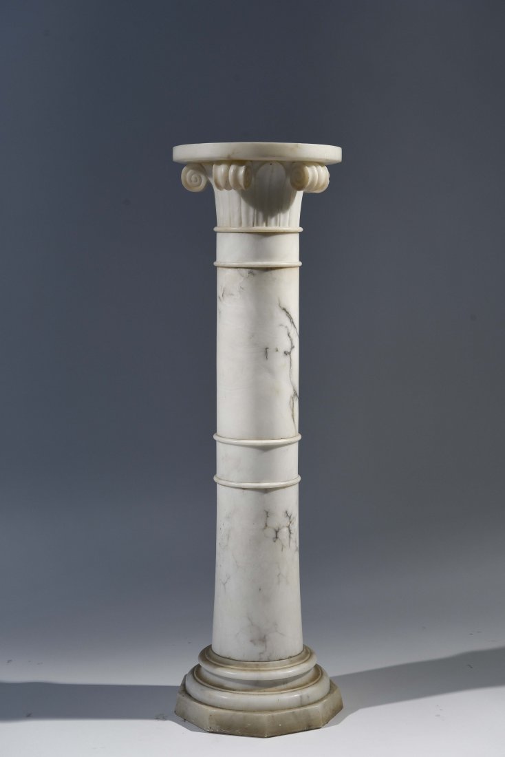 CIRCA 1920S IONIC COLLUMN CARVED ALABASTER PILLAR: Dimensions: H 39.25" x Dia 11.5" Condition: Scratches throughout, chips to edges