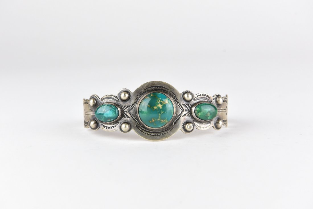 NAVAJO SILVER & TURQUOISE BRACELET 29: Hallmarked IH (Indian Handmade) and Coin silver. Dimensions: Inside diameter: 5.5" x 1.25" opening X 1" wide Weight: 0.85 ozt Condition: Nothing to note.