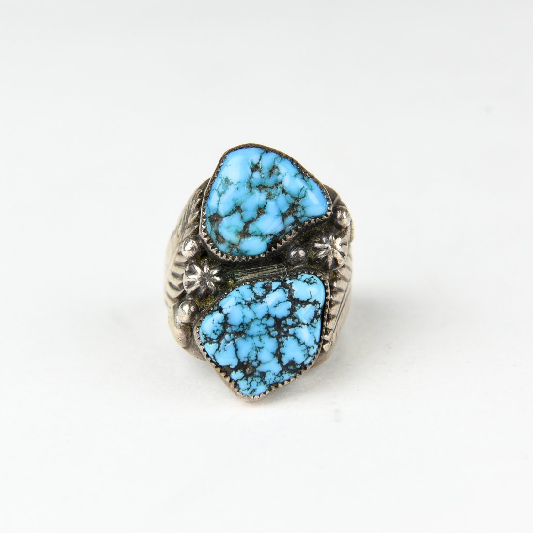 2 STONE STERLING AND TURQUOISE RING: Hallmarked J. Silversmith, Native American Ring Size: 9.5 Weight: 1 ozt Condition: Wear consistent with age and use