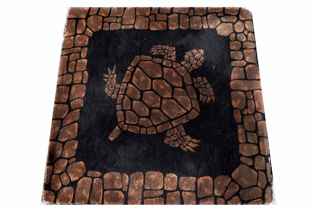EDWARD FIELDS TURTLE RUG: Pauline Trigere's carpet, from her estate. Dimensions: H60" x W 61" Condition: Frayed and loss all the around the edges of the rug.