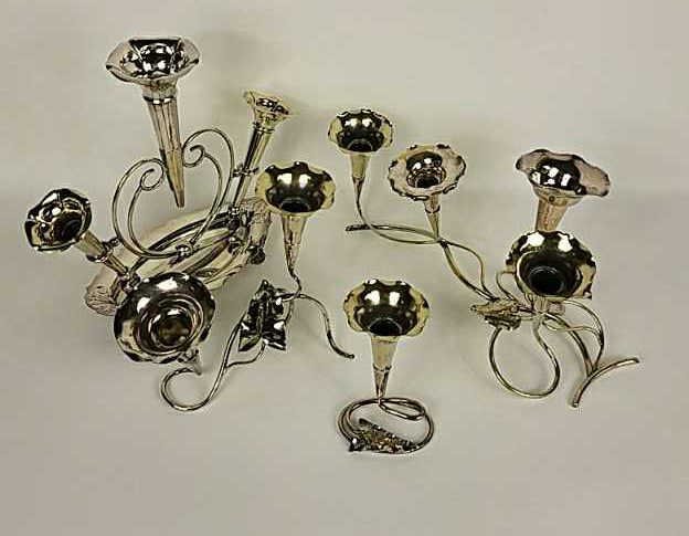 SILVER PLATE EPERGNE: Trumpets removable and interchangeable. Not hallmarked. Dimensions: H 7" x W 15" x D 8" Condition: Some loss to plating, some slightly bent.