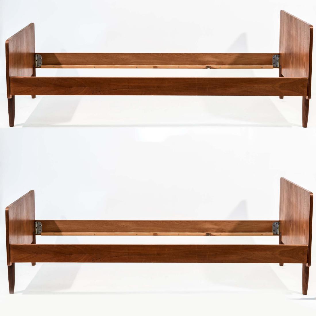 PAIR OF TEAK GUEST BEDS: Denmark 1950's Dimensions: H 27" x W 76" x D 35.5" Condition: Few scuffs, dings, and white paint marks. Some scratches to bed rails. Top edge laminate of one headboard chipping. Large crack in leg of 