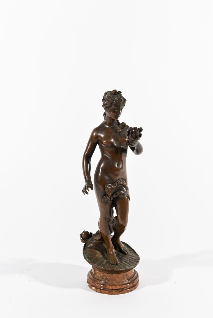 VIENNA BRONZE FEMALE NUDE SCULPTURE: Female standing on a water lily pad and holding a lily. Dimensions: H 11.5" x W 3.25" X D 4" Condition: Chips to the dark brown marble base.