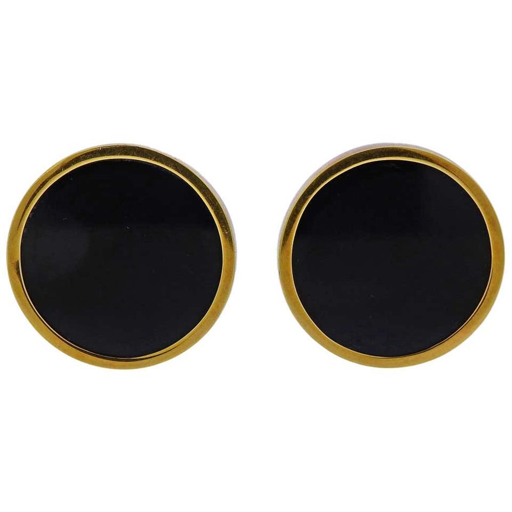 Andrew Grima Onyx 18k Gold Earrings: Pair of 18k yellow gold round earrings by Andrew Grima, set with black onyx. Earrings are 23mm in diameter. Weigh 19 grams. Grima, 750, English marks.E-02045