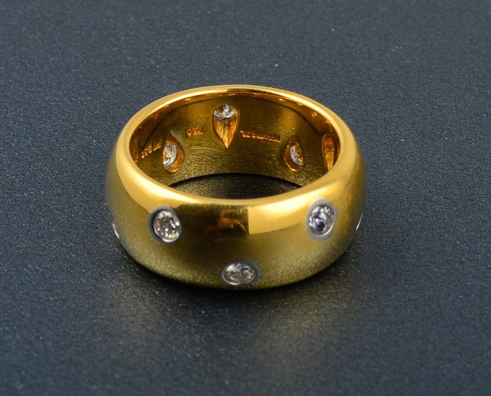 Tiffany & Co diamond gold band: 18K yellow gold and platinum diamond band 10 round full cut diamond weighing approximately 0.5 Ct Ring size:4 1/2 Dimension: 8mm wide Signed: Tiffany & Co 750 PT 950 Gross weight: 6.6 dwt