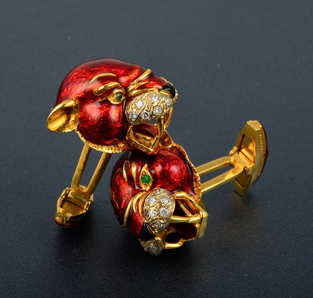Modele F.C. Depose 18K yg Panther cuff-links: A pair of 18K yg enamalized panther form cufflinks set with emerald eyes and diamonds accenting a reddish enamel head marked Modele F.C, Depose 1 1/2" L 23.4 dwt