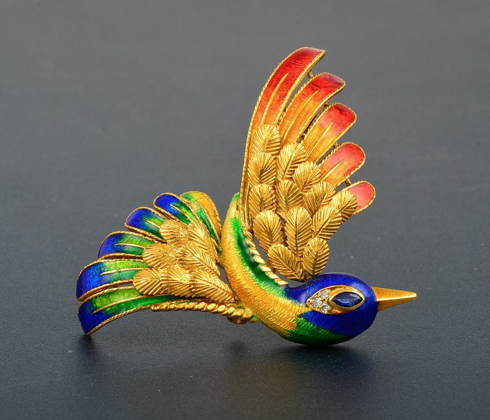 Mauboussin enamel bird brooch: Mauboussin diamond enamel bird brooch 18K yellow poly-chrome enamel and 3 single cut diamond and sapphire eye. Dimension: 2" x 2 1/8" Signed: MAUBOSSIN PARIS Gross weight: 11.9 dwt
