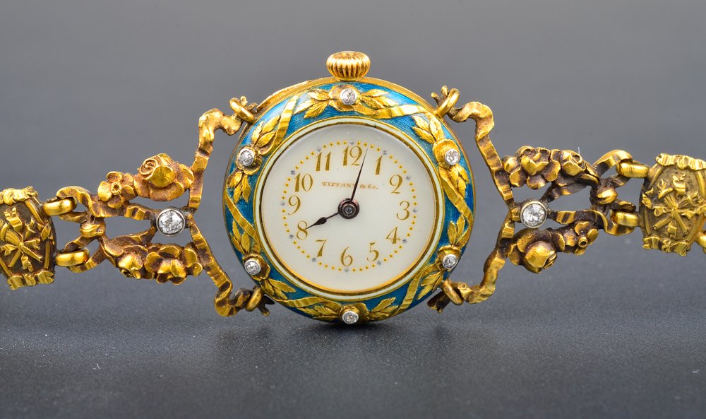 Tiffany & Co, Art Nouveau enamel wristwatch: Tiffany & Co. 18K yg enamel wristwatch with 12 old mine cut diamonds Dimension 6 3/4 " L Gross weight: 28.6 dwt