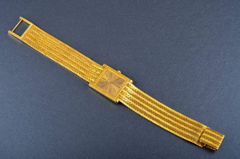 Piaget yellow gold Man's wrist watch: 18K yellow gold mesh band. Dimension: 1" x 1" x 7 3/4" Gross weight: 42.6 dwt