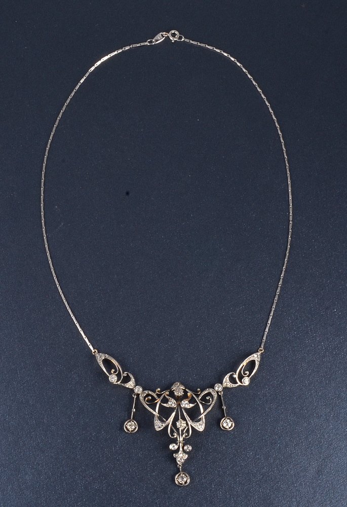 Edwardian diamond drop necklace: Platinum top gold back pierced openwork garland diamond drop necklace. All diamonds are old European and old mine cut. Signed: chain claps stamp 750 Dimension: 18" L