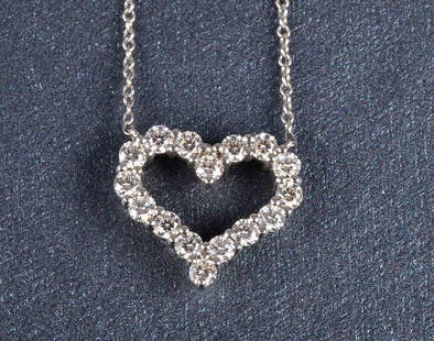 Tiffany & Co diamond heart pendant necklace: Tiffany & Co diamond heart pendent chain necklace with 16 full cut diamonds weighing approximately 1ct Signed: Tiffany & Co PT950 on both pendent and chain clasp. Dimension: 16mm x 16mm and 16" chain