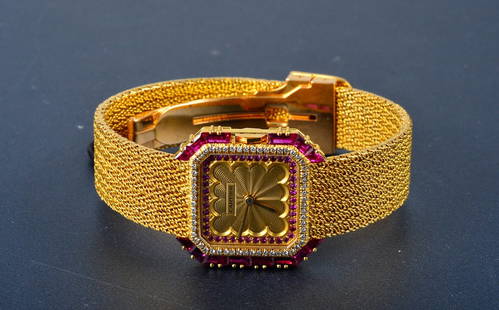 "Cartier 18K yellow gold & diamond & ruby wristwa: Cartier 18K yellow gold diamond & ruby lady's wristwatch. 14 vivid red ruby on bezel and numerous round cut ruby on dial. Dimension: 1" Signed: Cartier Paris 781004245 gold maker's mark Note: deployme