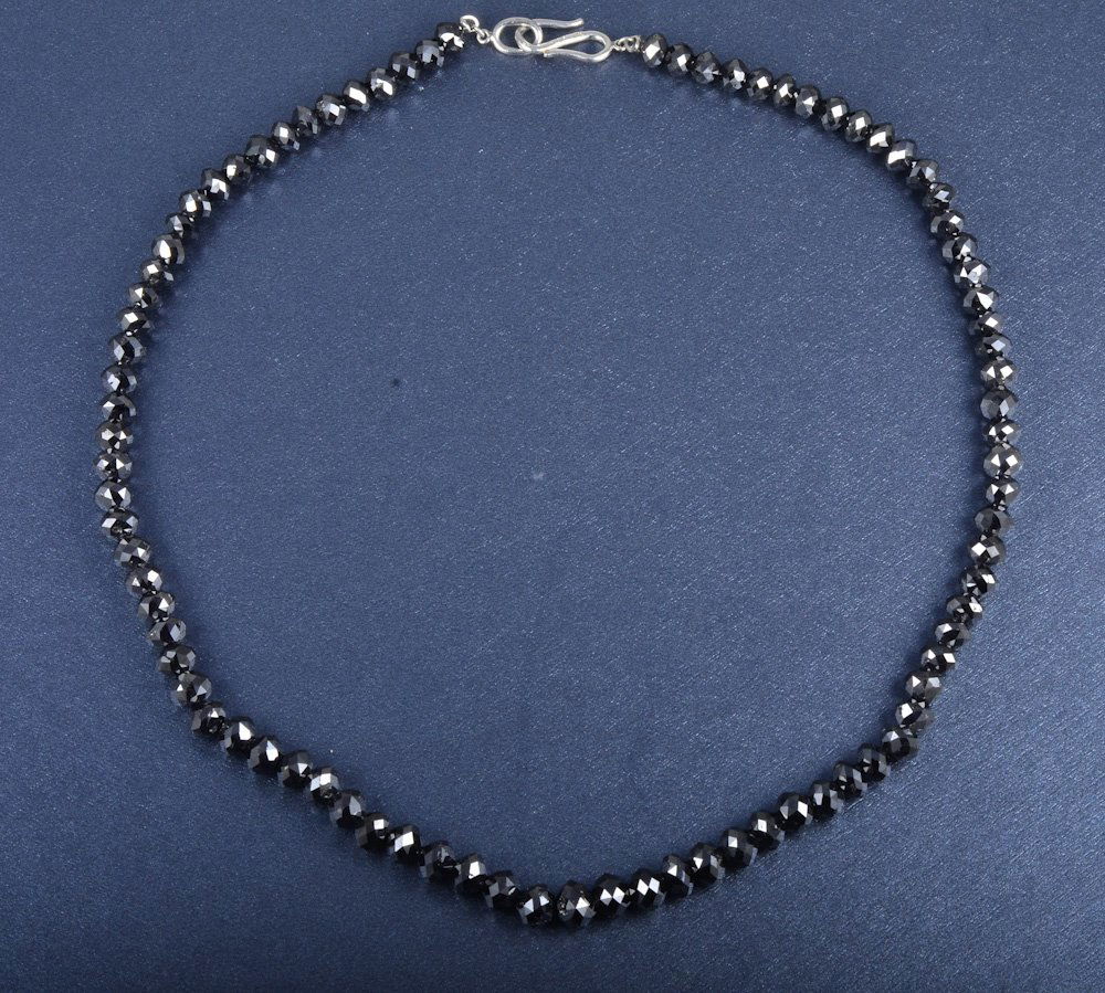Julius Cohen Platinum and black diamond necklace: A Julius Cohen black diamond necklace with a platinum "S" clasp, 86 beads, 17"l