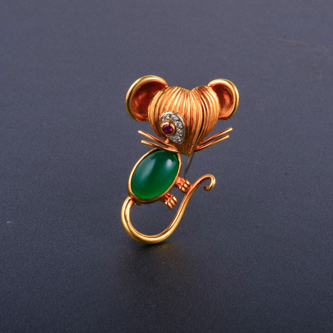VCA Gem-Set Mouse Brooch: A cute Van Cleef and Arpels gem-set 18k yellow gold mouse brooch with a green onyx body, ruby eyes surrounded by diamonds Stamp V.C.A., 94538, 750, gold makers mark Dimension 1 1/2" x 7/8". On our har