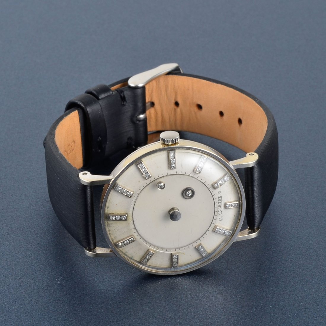 LeCoultre Men's Gold and Diamond Wrist Watch: LeCoultre men's 14k white gold wrist watch with "mystery dial" hands. Vacheron Constantin mechanical movement and leather band. Signed Vacheron Constantin - LeCoultre watches, Inc 14K gold 38 round di