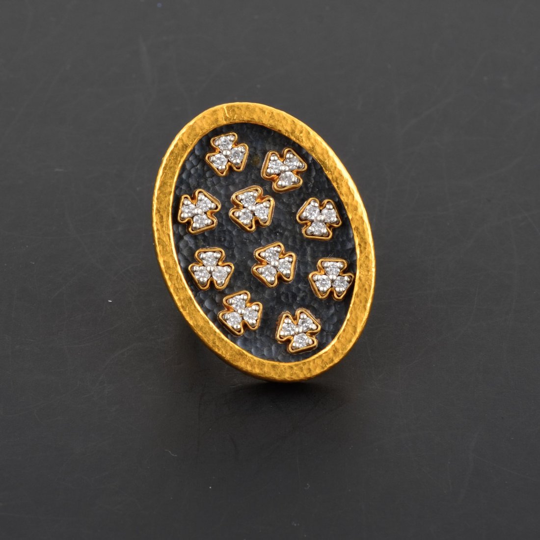 Gurhan Hammered 24K YG & Silver Imperial Clover Diamond: "Stamped D.G. Gurhan. Hammered 24K yellow gold and silver clover diamond ring, set with approx. 30 RBC diamonds weighing 0.99CT. Weighs 16.8DWT. Ring size 5. In store retail selling price is $9,480."