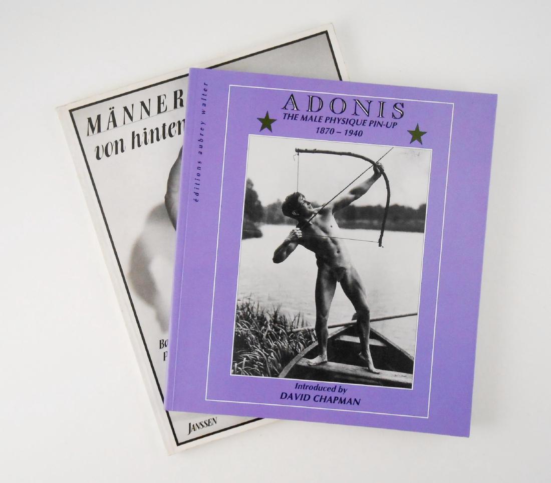 Two Male Physique Pin-Up Books: Adonis: The Male Physique Pin-Up 1870-1940 together with "Manner von hinten, Band 1: Photographie 1900-1970." Both books have soft covers and are in very good condition.