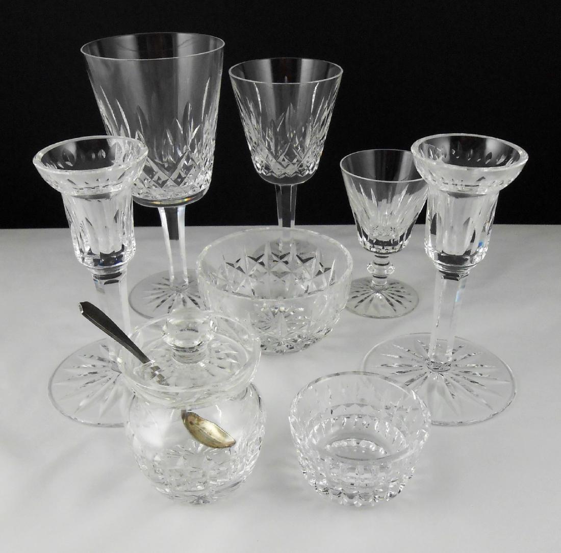 Group Of Waterford Crystal: Lot of Waterford crystal, including pair of single candlesticks (H. 5 1/2 inches), two small bowls (largest diameter is 3 7/8 inches), mustard or jam pot with sterling silver spoon (H. 3 3/4 inches), 