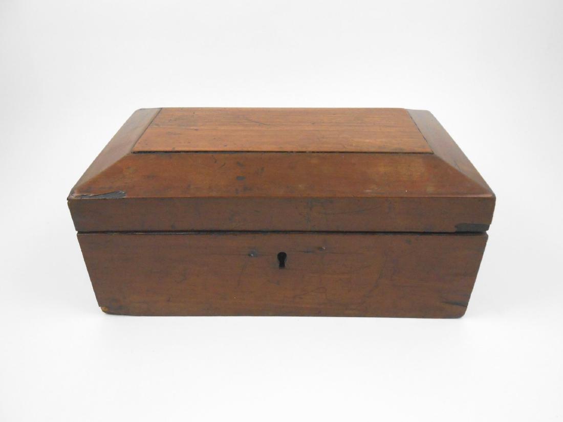 Antique Walnut Box: Antique European walnut box of rectangular form, having a hinged lid with chamfered edges. Circa late 19th century. L. 10 1/4 inches x D. 6 inches x H. 4 1/2 inches THIS LOT IS BEING OFFERED WITH NO R