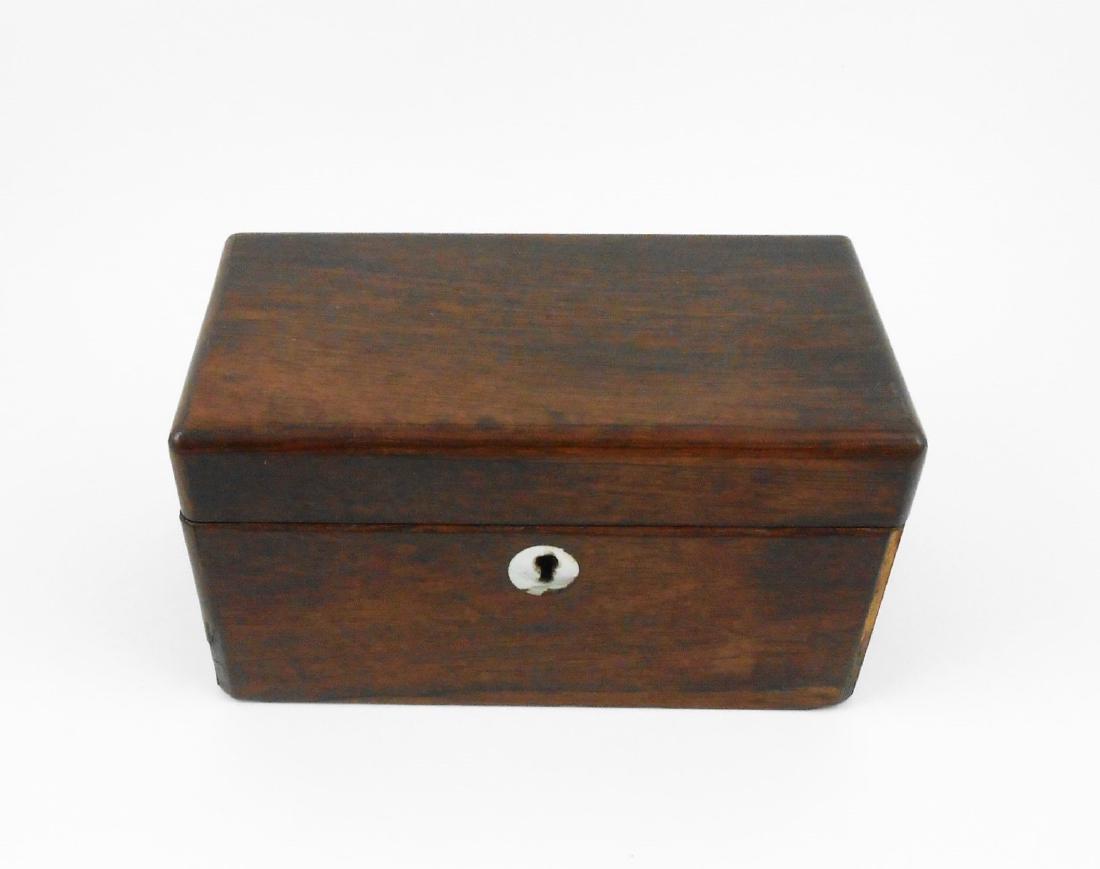 19th Century Walnut Box: Walnut box of rectangular form, having a hinged lid and mother-of-pearl inlaid key escutcheon. Circa mid-late 19th century. L. 7 1/2 inches x D. 4 inches x H. 4 inches. THIS LOT IS BEING OFFERED WITH 