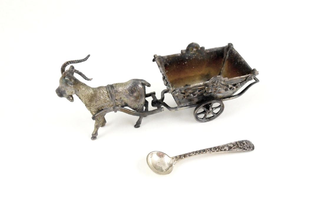 European Figural Sterling Silver Salt Cellar: Unusual Continental sterling silver salt cellar in the form of a goat pulling a wagon. Hallmarks indecipherable. Associated sterling silver salt spoon by Kirk. Total weight approximately 2.75 oz.