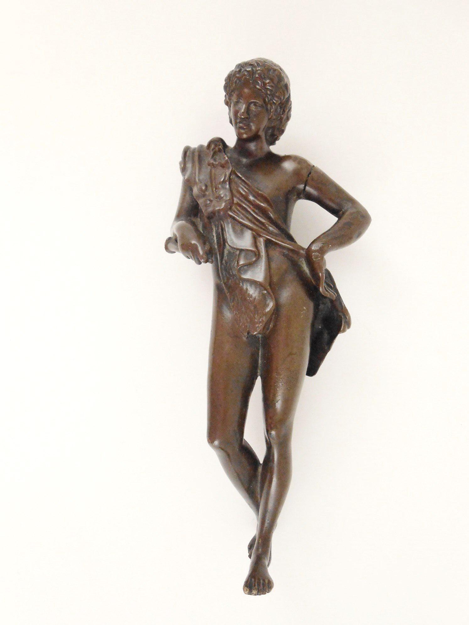 Antique Bronze Figure, 19th Century: Antique bronze Classical-style figure of a youth holding a flute, probably Italian, circa early 19th century. H. 6 1/2 inches.