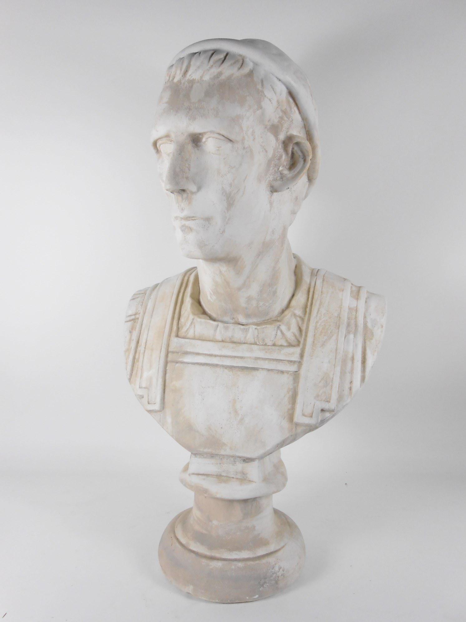 Plaster Bust Of Roman Emperor: Plaster bust depicting a Roman emperor. Probably Italian, circa late 19th century. Unsigned. H. 26 inches. Having some cracks and losses consistent with age but no apparent repairs.