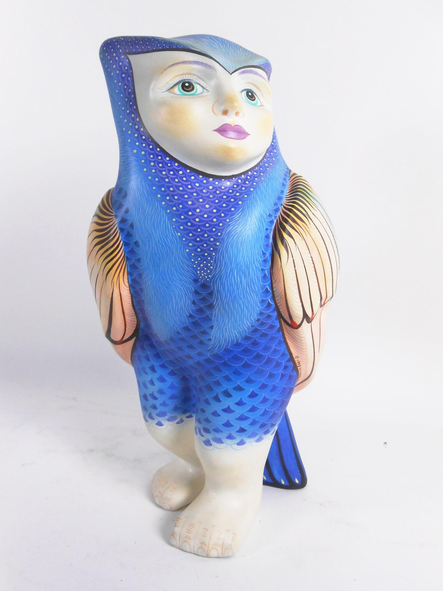 Figural Sculpture By Alexander Flores: Limited edition contemporary figural sculpture of an owl with human features by Alexander Flores (Mexico, b. 1962). Crafted of composition material and decorated in vivid colors with gilt highlights. 