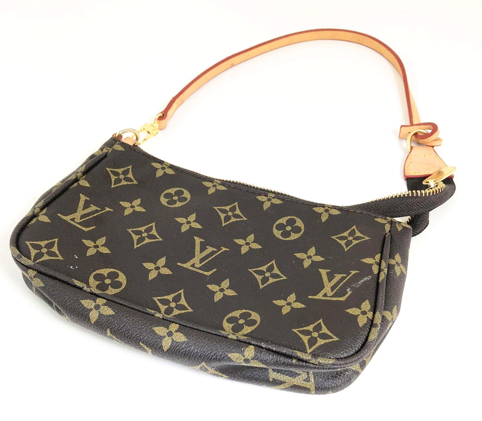 Louis Vuitton Monogram Clutch Purse: Louis Vuitton lady's Monogram clutch bag, approximately 8 1/2 x 5 1/2 inches. Strap measures approximately 17 inches.