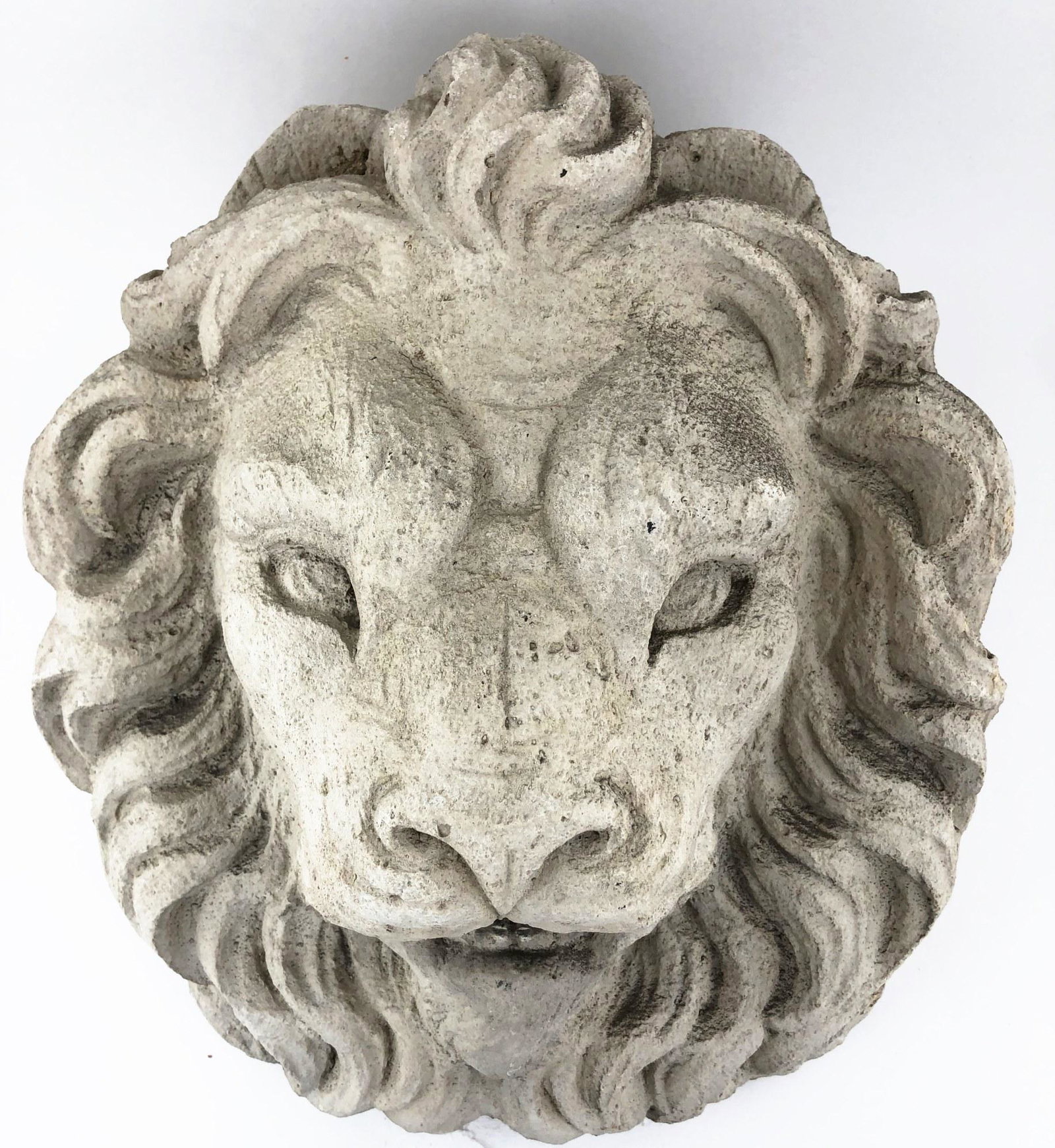 Lion Mask Fountainhead: Cast composite lion-mask form fountainhead, circa 20th century. L. 13 inches W. 14 inches