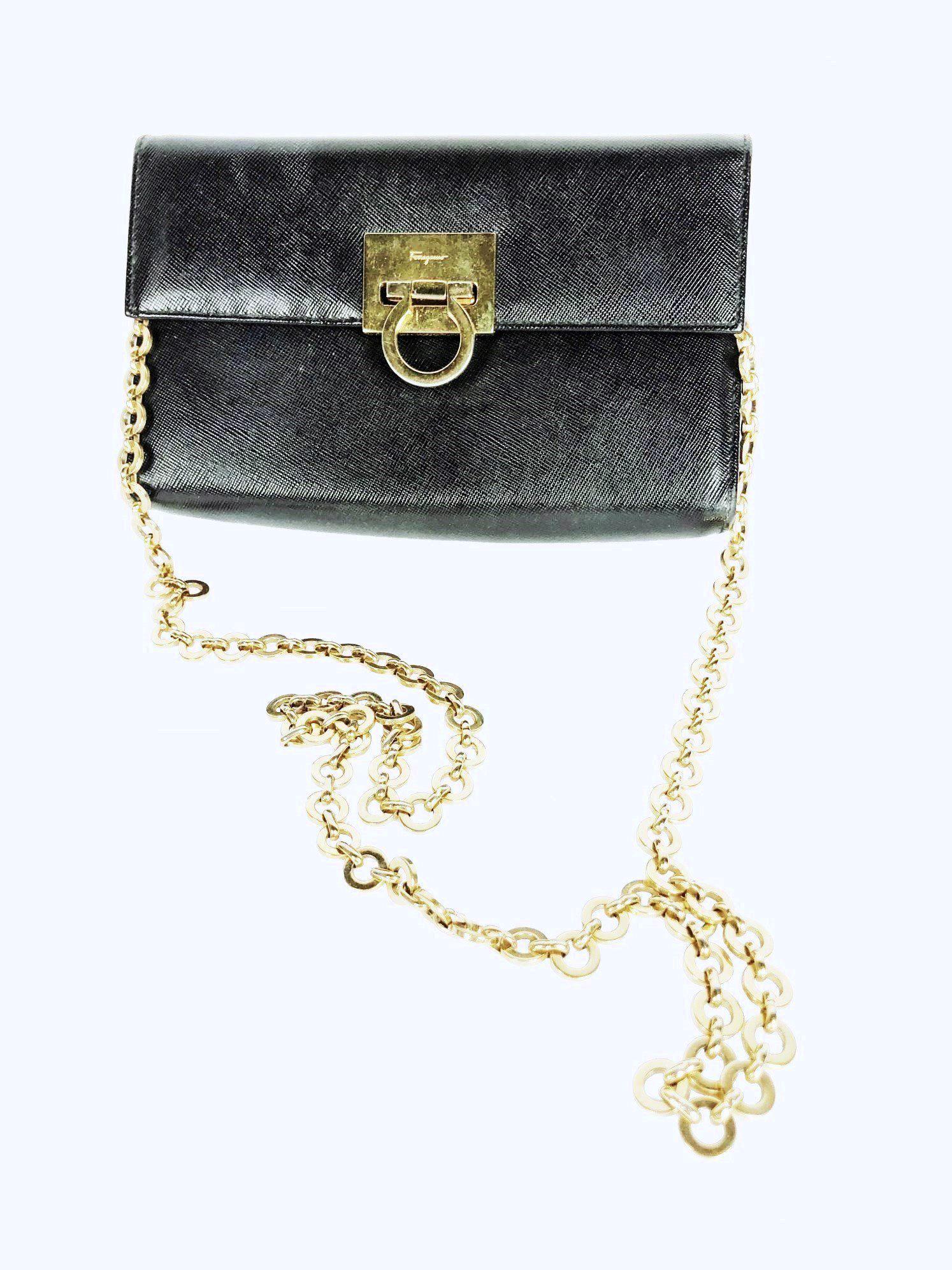 Salvatore Ferragamo Clutch: Lady's clutch bag with 15-inch shoulder chain, by Salvatore Ferragamo. Recent design. Very good condition. 8 x 5 inches