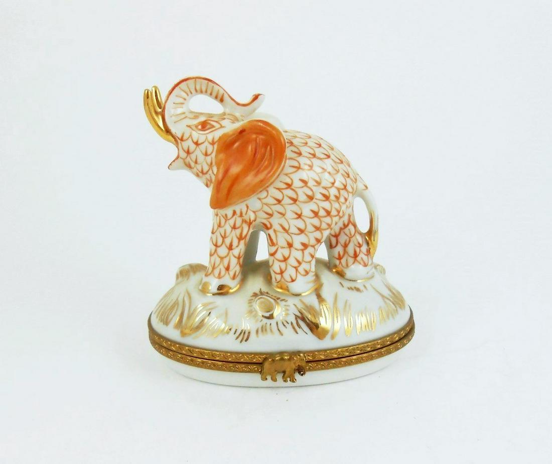 Limoges Porcelain Trinket Box: Handpainted (peint main) Limoges porcelain trinket box, hinged lid. L. 3 1/2 inches. No apparent damage or repairs.