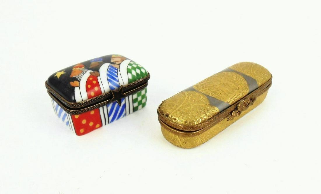 Two Limoges Porcelain Boxes: Two handpainted (peint main) Limoges porcelain boxes, one 2 inches long, one 3 1/8 inches long. No apparent damage or repairs.