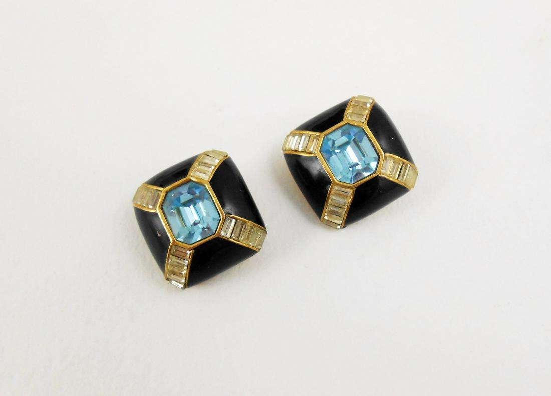 Vintage Pair Of Earclips By Ciner: Vintage pair of earclips by Ciner. Gold plated with enamel and glass stones. 1 x 1 inch.
