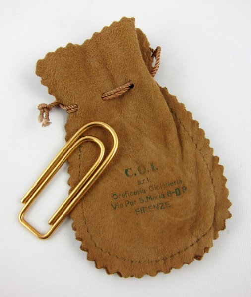 18KT Italian Gold "Paperclip": Paperclip form moneyclip, Italian, stamped 750. Very good condition. L. 1 3/4 inches. A gift to the present owner by Gene Moore. Gene Moore (1910-1998) was vice-president of window display at Tiffany 