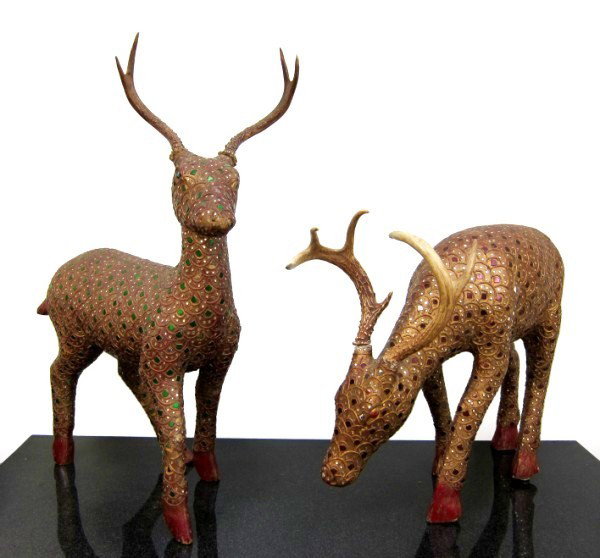 Tibetan Carved Giltwood Deer: Inlaid with red and green glass and mounted with genuine deer horns. Circa late 20th century. One measuring approximately 22 x 30 inches, the other, 24 x 20 inches. Purchased 1980 at Neiman Marcus.