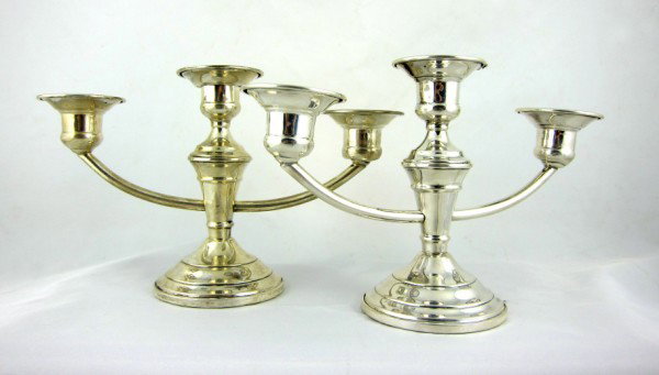 Pair 3-Branch Sterling Silver Candelabra: Small pair of American sterling silver candelabra. Weighted bases. Hallmarked. Length 8 inches.Height 4 3/4 inches.
