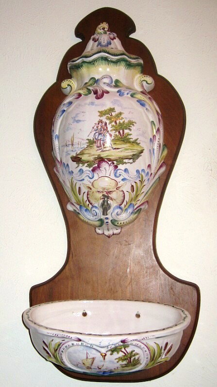 European Faience Lavabo: Nicely painted faience lavabo mounted on conforming shaped-wood panel, probably French, circa 1st quarter 20th century.